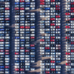 aerial view of cars in a row.