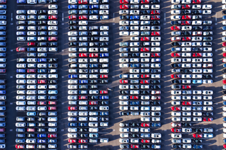 aerial view of cars in a row.