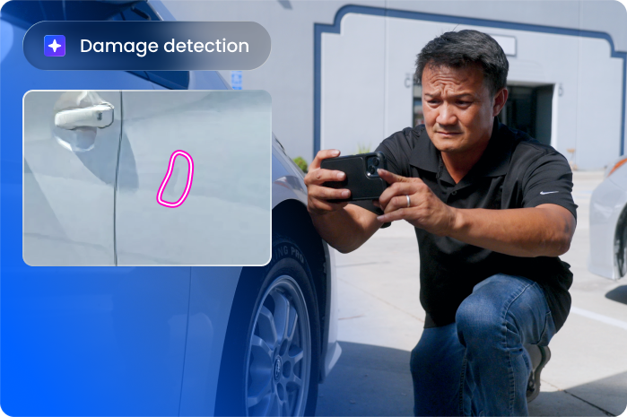 A man kneels next to a silver car, taking a photo of a dent near the door handle. A graphic overlay highlights the damaged area with a pink outline and a label that reads Damage detection.
