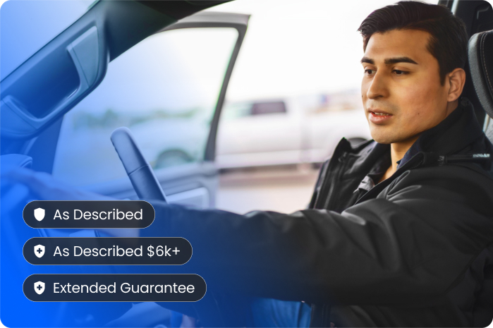 A person sits in the driver’s seat of a car with the door open, looking ahead. Overlay text displays check-marked features: As Described, As Described $6k+, and Extended Guarantee.